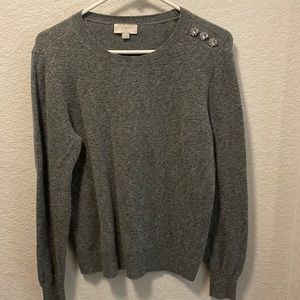 Women’s sweater with decorative button details